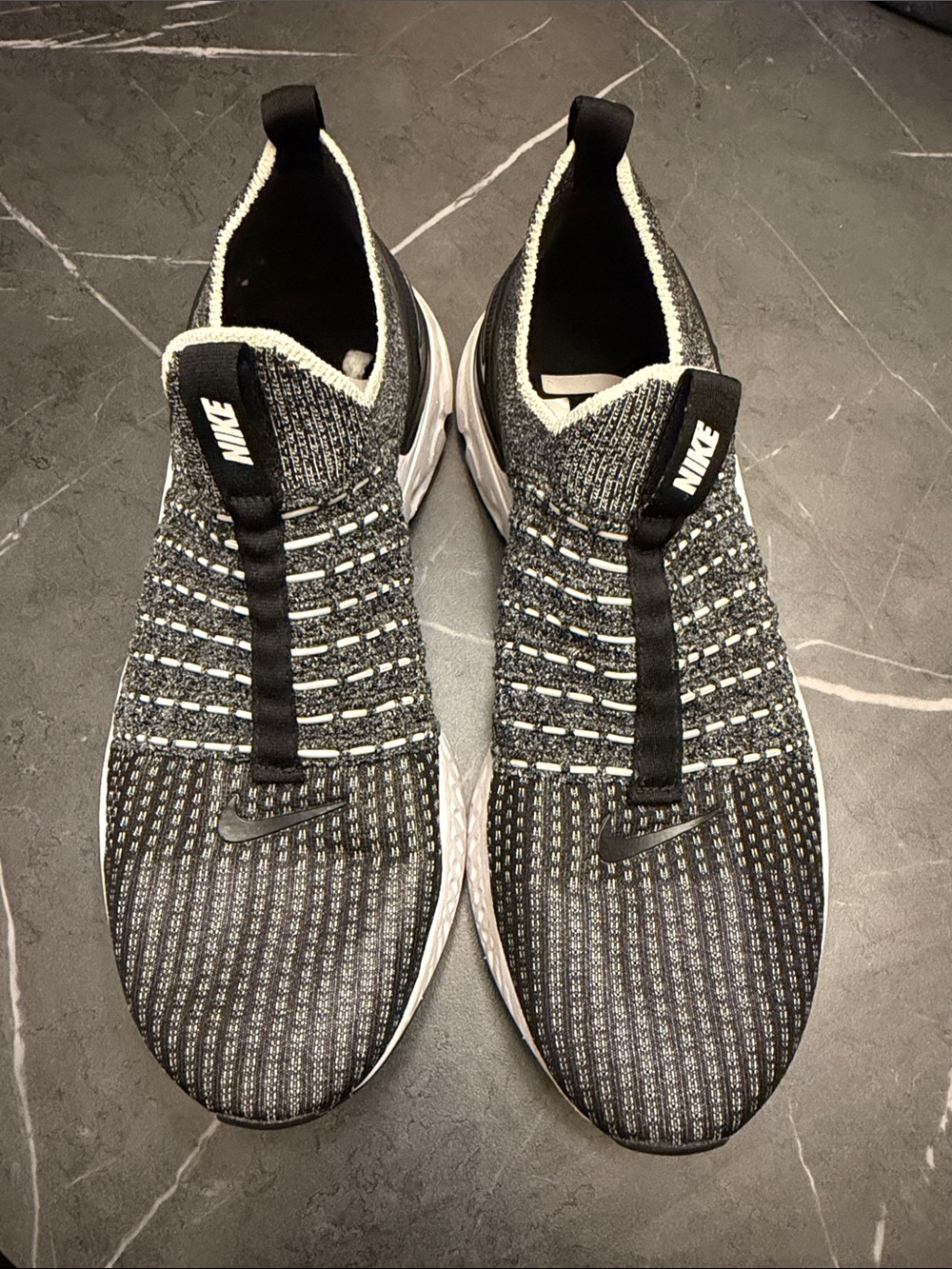 Nike Men’s Black and White Knit Slip-On Sneakers